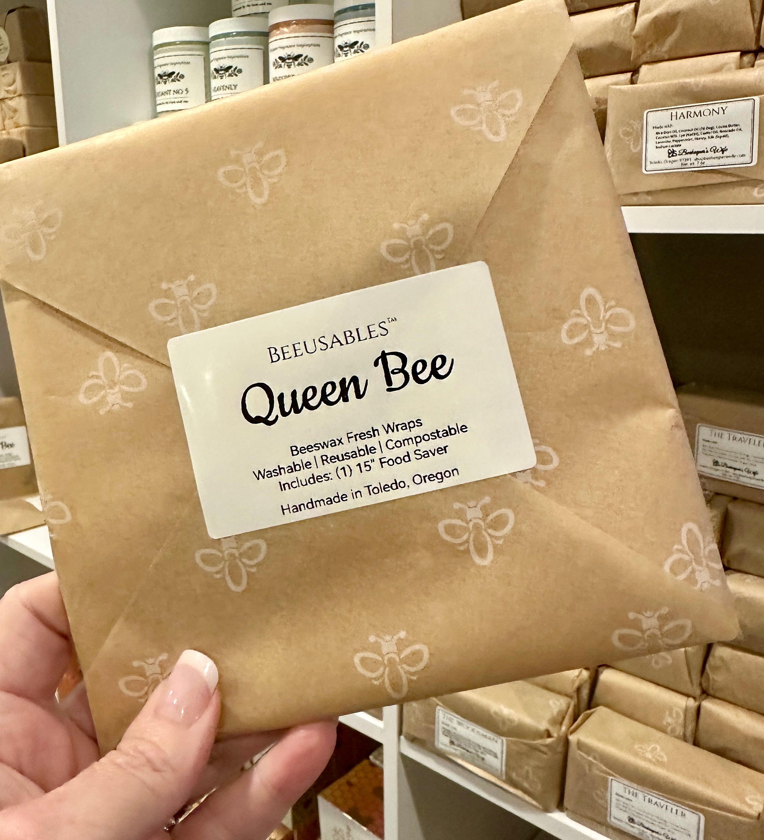 BEEUSABLES Queen Bee package held by a hand with more packages in the background.