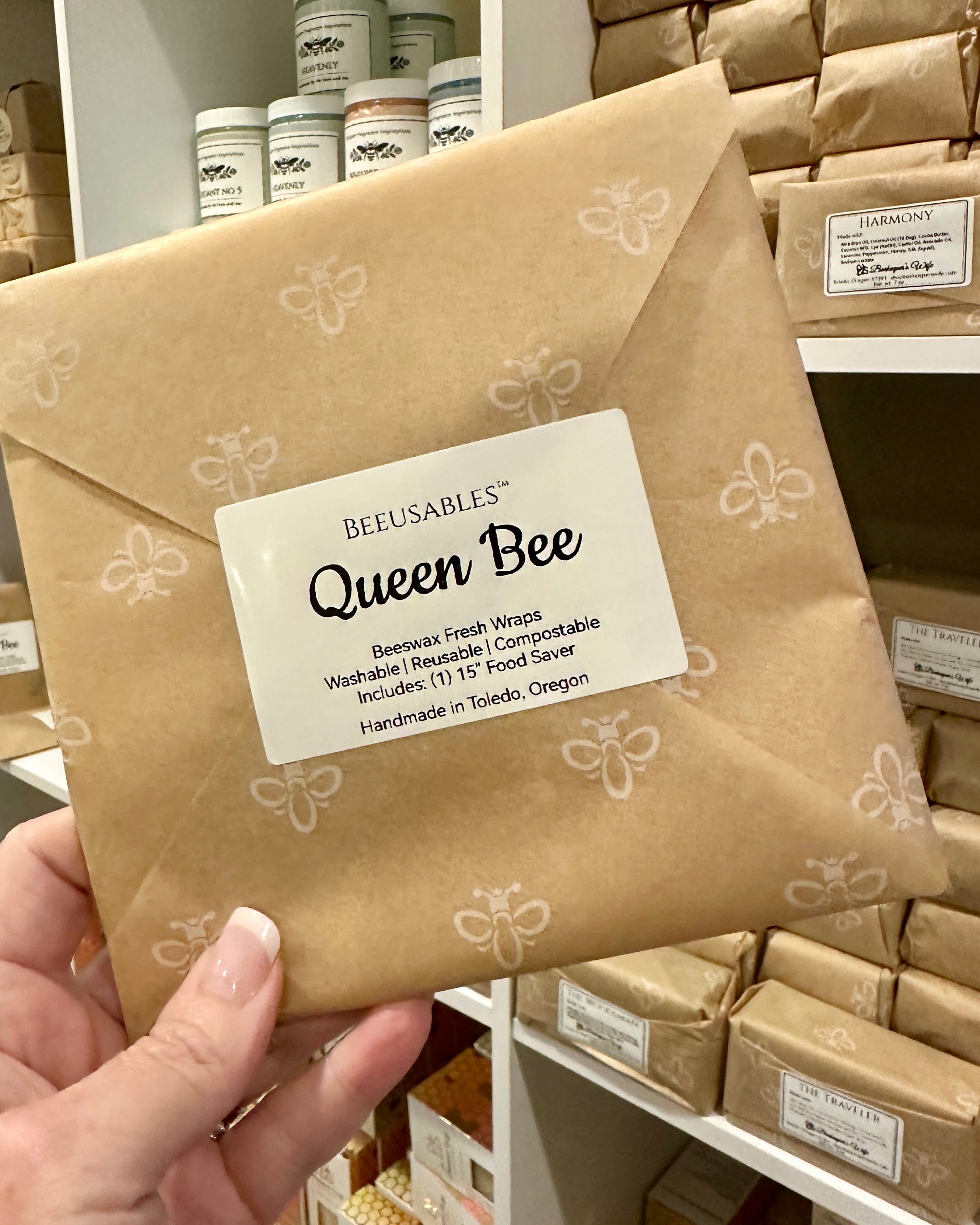 BEEUSABLES Queen Bee package held by a hand with more packages in the background.