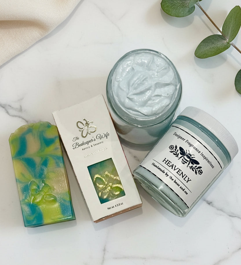 Three beauty products including a jar of cream, a bar of soap, and a container labeled 'Heavenly' on a white background.