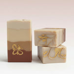 Luxury soap with gold accents on a white surface